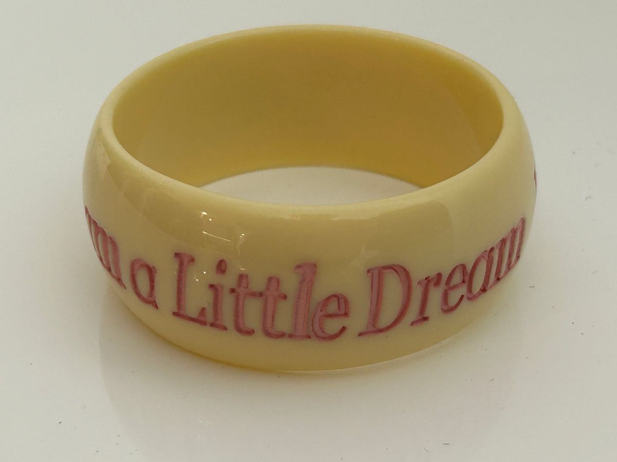 Vintage 1980s Chunky Cream & Pink "DREAM A LITTLE DREAM" Etched Bangle